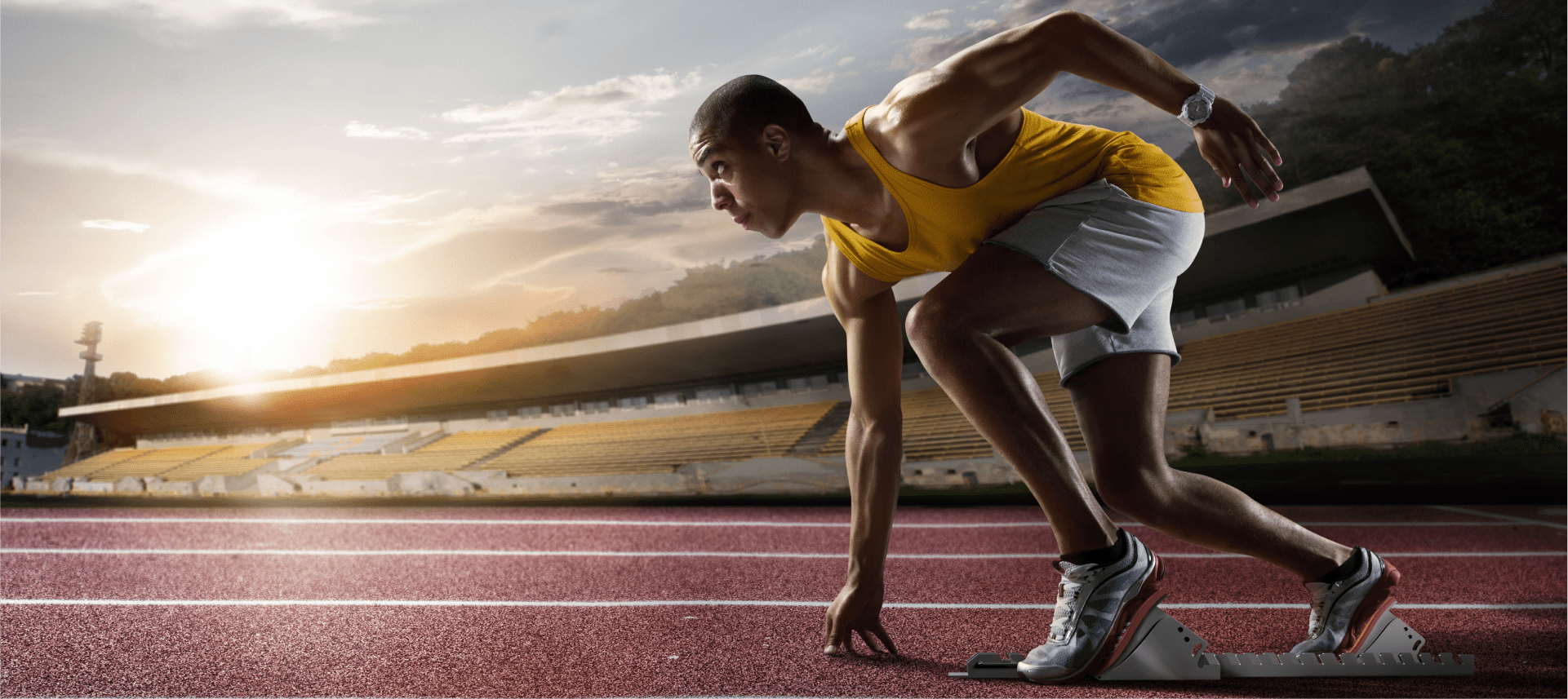 Athlete preparing to run on track.