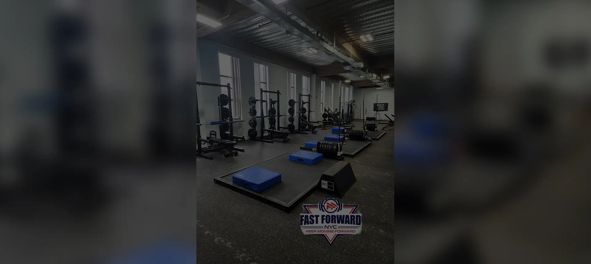 A modern gym area with various workout stations and equipment.