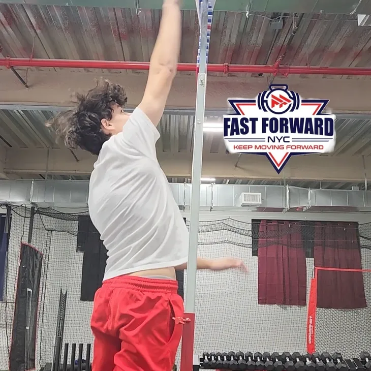 Athlete jumping indoors during a training session at Fast Forward Gym.