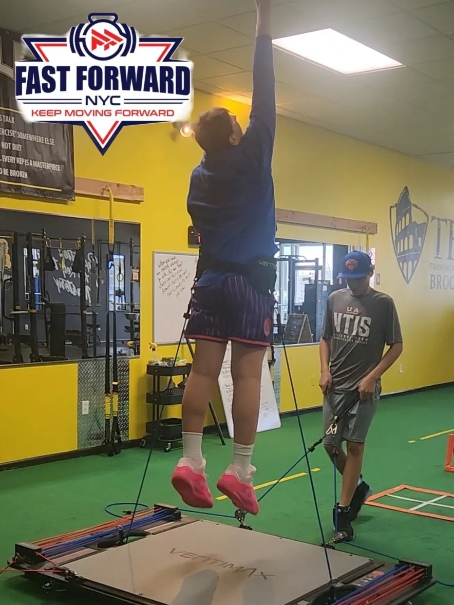 Athlete jumping rope in gym training session.